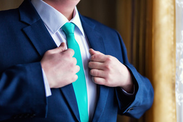 Businessman wears a jacket. Sharp dressed fashionist wearing jac