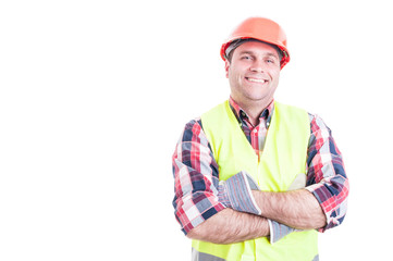 Confident cheerful builder posing with folded arms