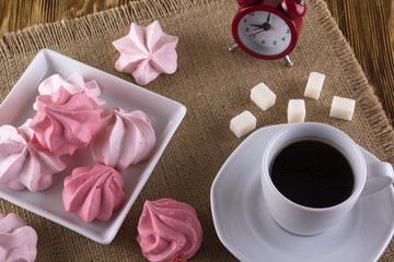 Meringue Cookies and cup of coffee.