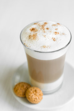 Glass of cafe latte with biscotti