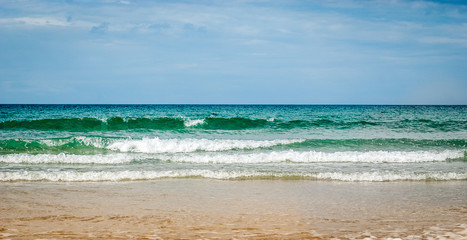 Fototapeta na wymiar Tropical sandy beach with clear sky at the low tide. Atlantic oc