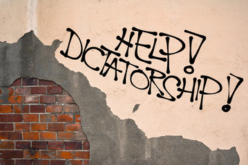 Help! Dictatorship - Handwritten graffiti sprayed on the wall, anarchist aesthetics - danger of...