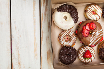 Colorful donuts in box