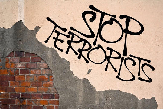 Stop Terrorists - Handwritten graffiti sprayed on the wall, anarchist aesthetics - Appeal to establish security and prevention to prevent terrorism and killing of innocent victims during attacks
