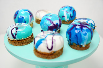 Vibrant cupcakes on white background