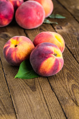 fresh peaches on wood background