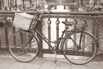 Fototapeta na wymiar Bike near Canal in Amsterdam, Holand