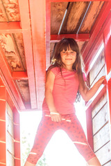 young smiling girl doing parkour