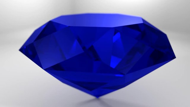 Sapphire blue diamond gemstone gem stone spinning wedding background loop 4K

