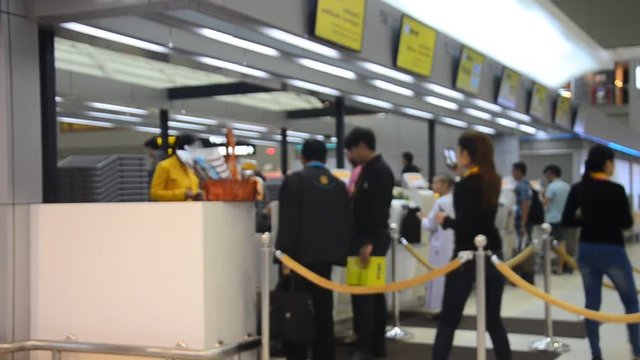 Thai people and traveller waiting and check-in ticket for flight in Don Mueang International Airport on July 12, 2016 in Bangkok, Thailand