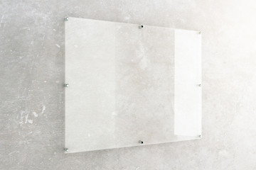 Glass plate on concrete wall