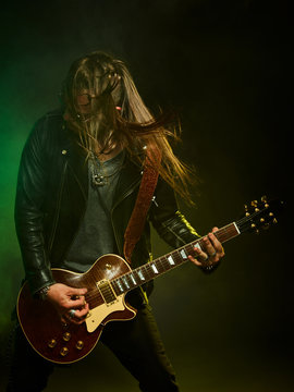The guitarist plays solo.