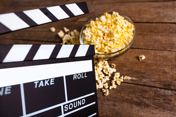 Movie clapper board and pop corn