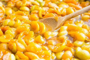 jam apricot. halves apricot in syrup. the process of making jam