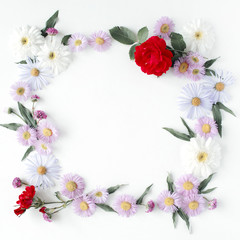 Naklejka na ściany i meble round frame wreath pattern with roses, pink flower buds, branches and leaves isolated on white background. flat lay, top view