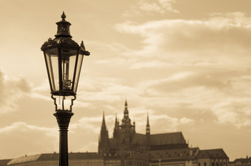 Fototapeta na wymiar Prague street lamp closeup against Cathedral of Saints Vitus