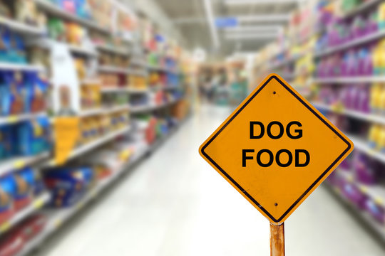 Blur image of dog food aisle in super market