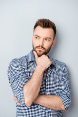 Obraz premium Portrait of young thoughtful businessman thinking about his work