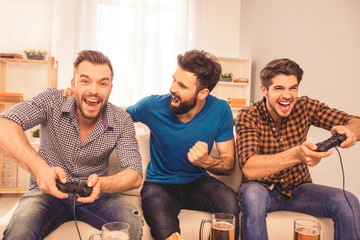 Men's contest! excited happy cheerful man play video game with h