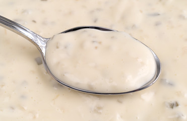 Tartar sauce on a spoon.