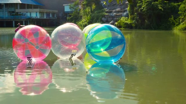 Video 1920x1080 - Inflatable balls for walking on water (zorbing) in the amusement park