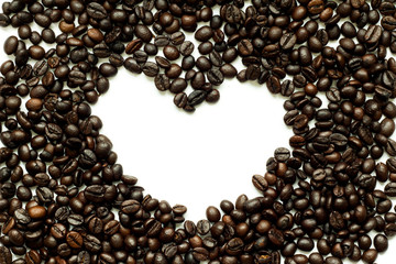 Roasted coffee bean as heart on white background