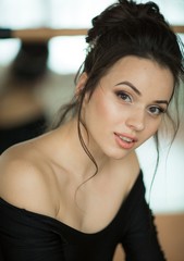 Portrait of beautiful young woman with makeup in fashion clothes