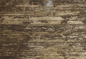 A full page close up of a distressed wooden floor board texture