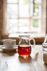 Tea in Transparent Glass on the Wooden Table with Big Window on the Background, Beautiful Light