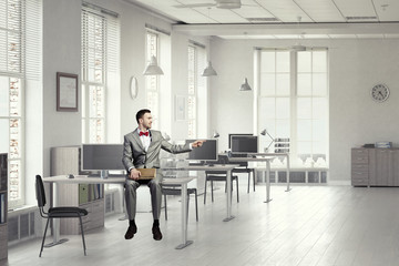 Businessman reading old book . Mixed media