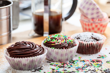 Cup cakes on a wooden surface