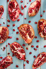 Fototapeta premium Pomegranate on blue wooden background