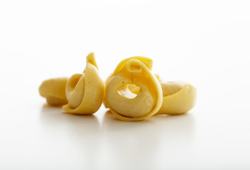Tortellini pasta on white background
