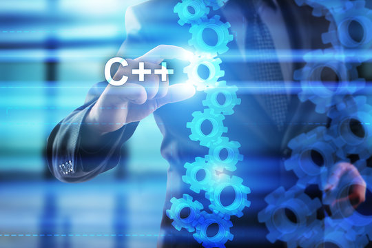 Businessman is selecting "C++" on the virtual screen.