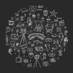 Hand drawn doodle Cinema set. Vector illustration. Movie making icons. Film symbols collection. Cinematography freehand elements: camera, film tape, photo camera, pizza, popcorn, projector, microphone