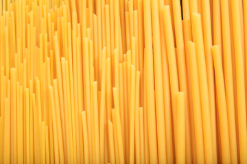 Full background of raw spaghetti pasta