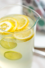 Jug of lemonade served on the dinner table