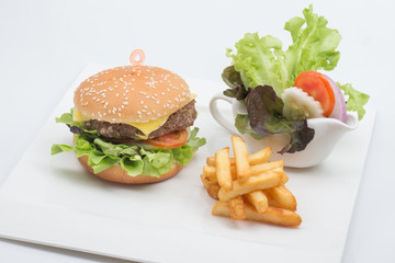 Cheese burger and chips with salad