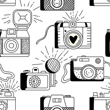Vector seamless pattern with retro cameras.