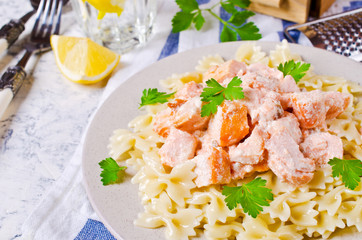 Pasta farfalle with salmon