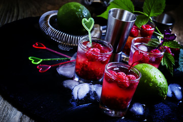Raspberry-lime chilled lemonade, dark background selective focus