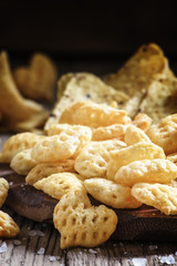 Corn chips, nachos, vintage wooden background, selective focus