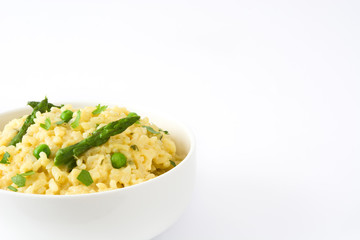 Risotto with asparagus and peas isolated on white background
