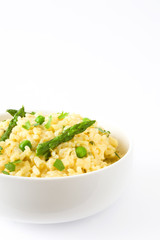 Risotto with asparagus and peas isolated on white background
