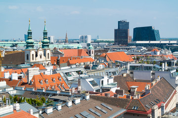 Panorama with Jesuit Church, City Tower and Wien Mitte building from north tower of St. Stephen's Cathedral in Vienna, Austria