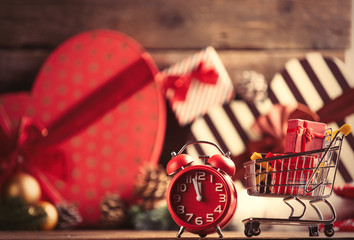 cart with gifts and alarm clock