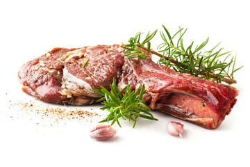 Fresh raw beef with spices and rosemary isolated on a white