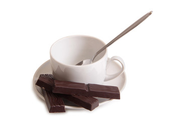 Coffee cup and chocolate on a white background