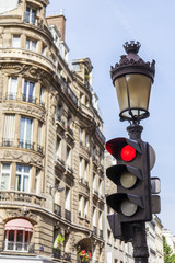 Obraz premium PARIS, FRANCE, on JULY 12, 2016. Typical urban view. Elements of transport navigation. The traffic light at the intersection