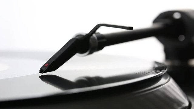 DJ needle on spinning turntable. Listening the music
